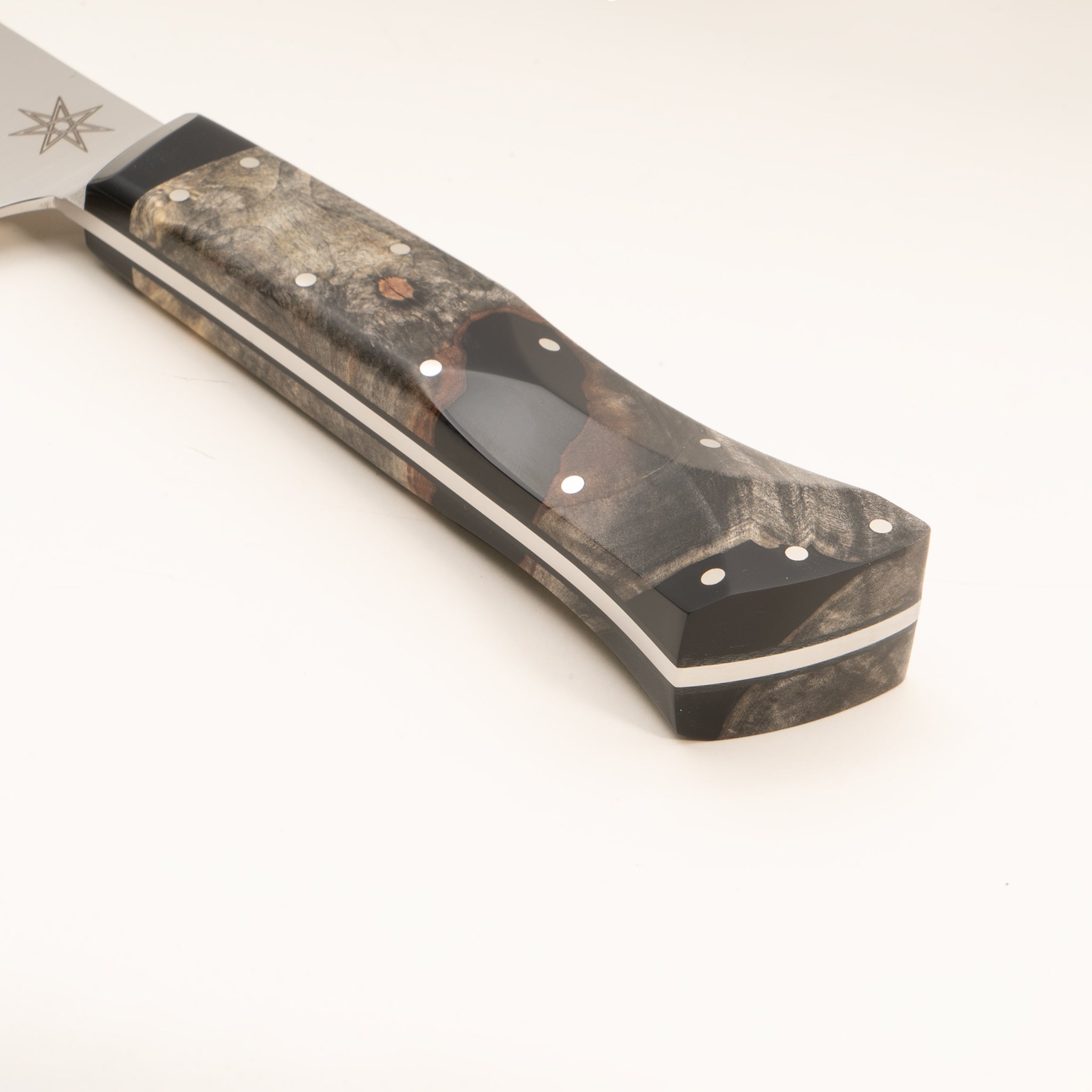 Detail photo of handle of stainless steel Desert Dawn nakiri vegetable knife with buckeye burl and black resin handle by Town Cutler. 