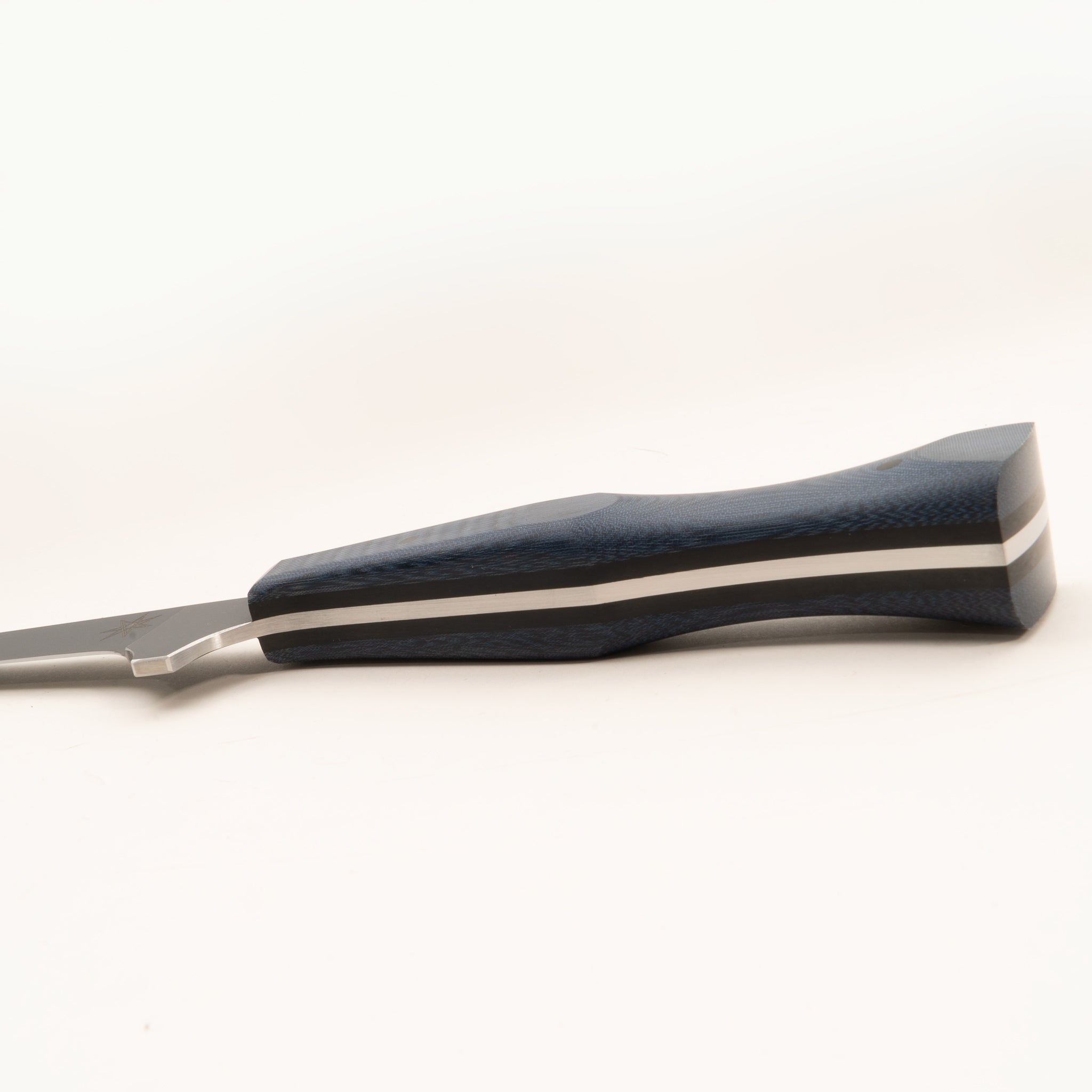 Detail photo of handle of stainless steel eXo Blue straight boning knife with blue linen micarta handle by Town Cutler.
