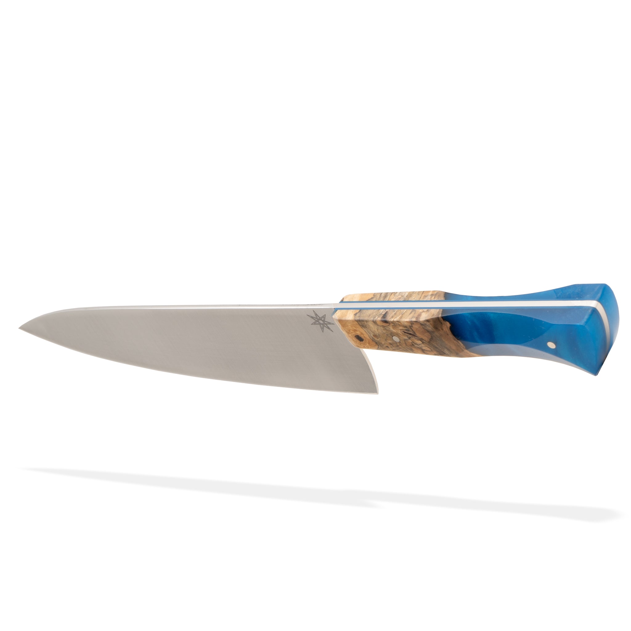 Detail photo of Tahoe Bliss stainless steel chef knife with buckeye burl wood and blue resin handle by Town Cutler.