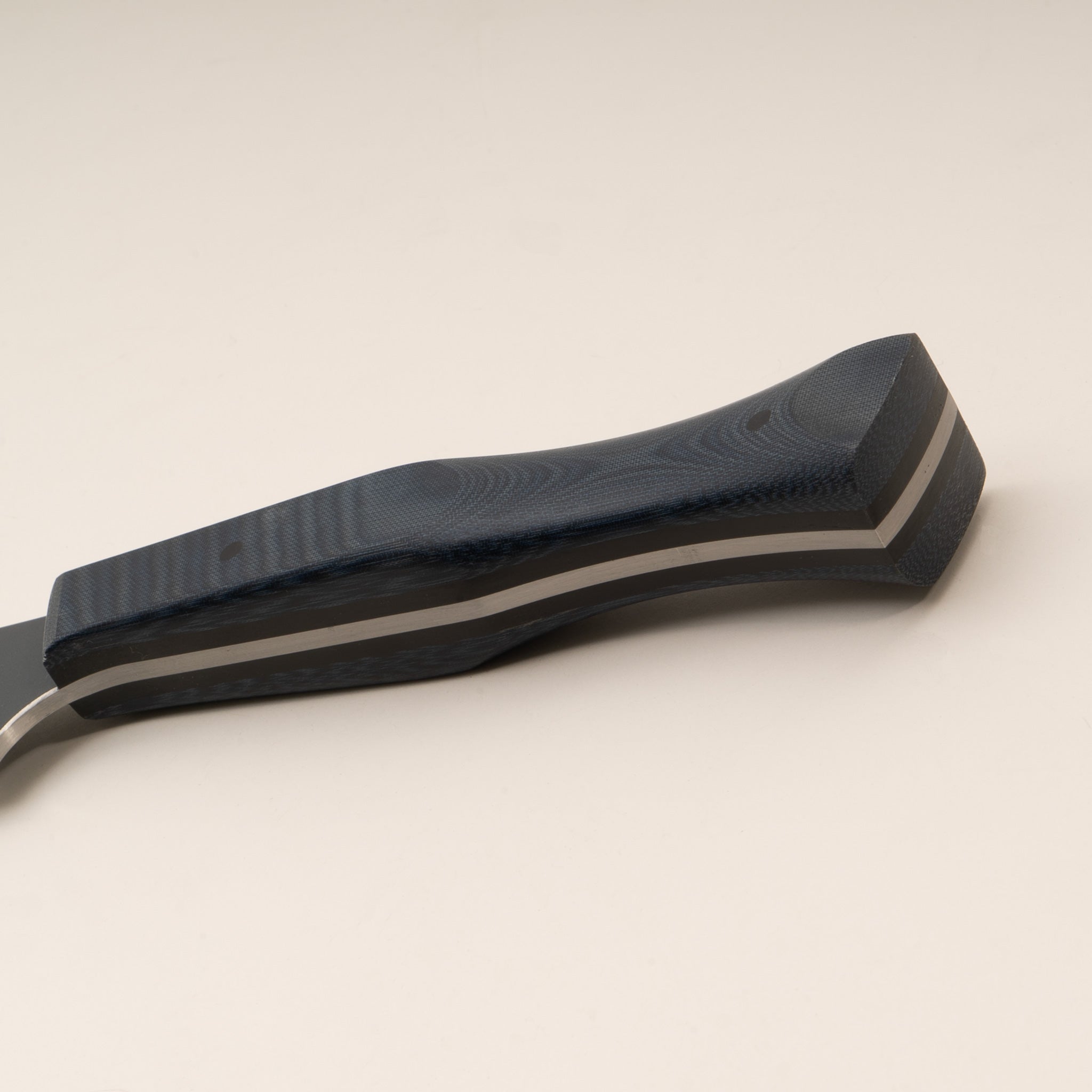 Close-up photo of a curved boning knife blue handle on a white background.